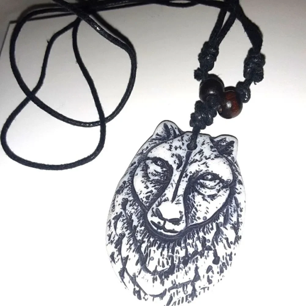 Hand CRAFTED UNISEX wolf charm with adjustable necklace